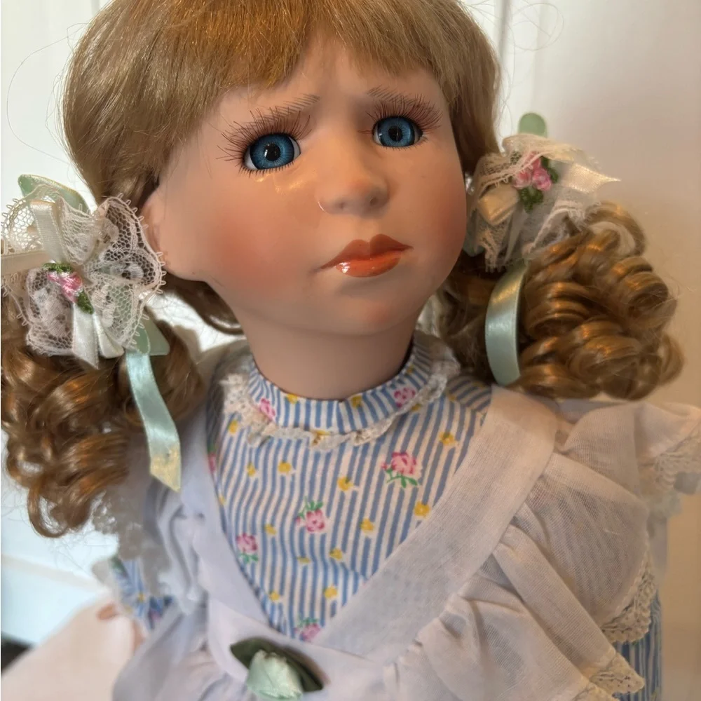Charming Blue and White Porcelain Doll with Curly Hair - Picture 3 of 11